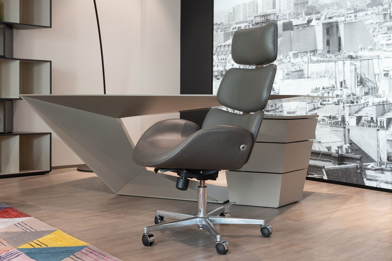 Empty executive chair and desk in a modern office